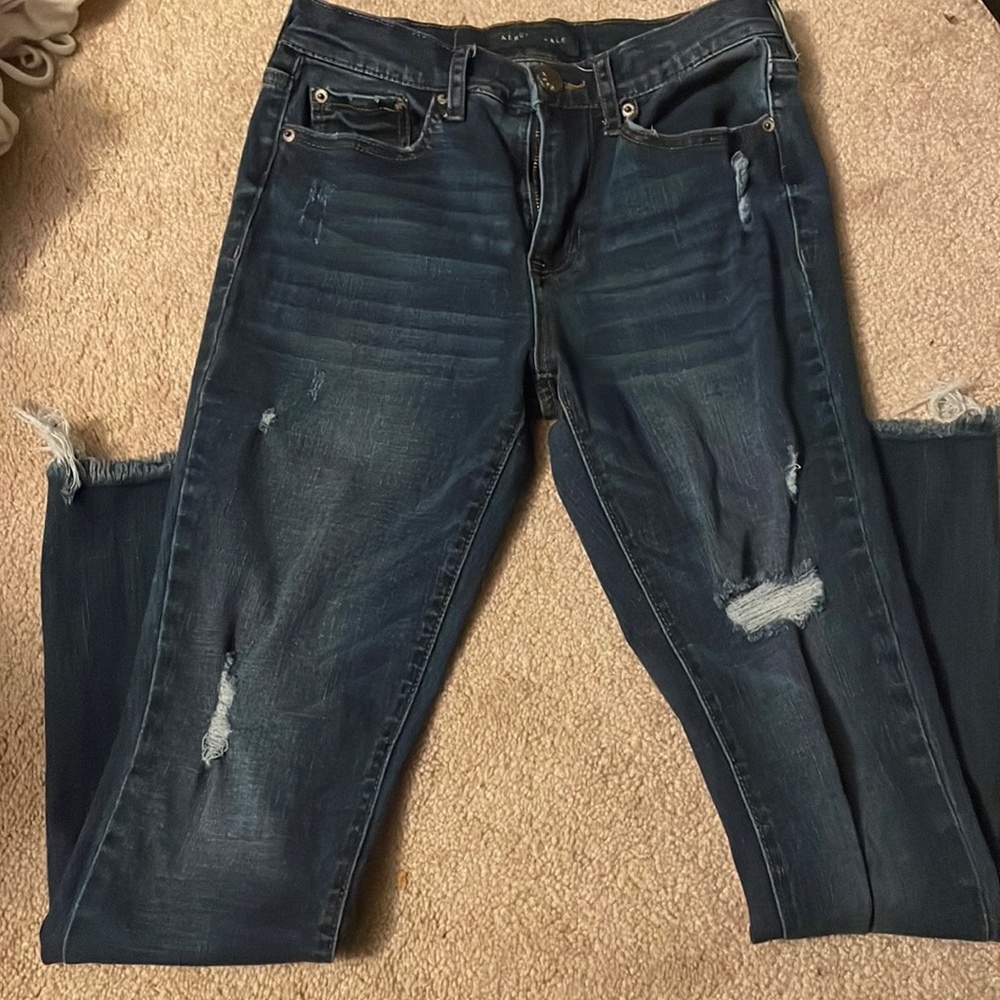 Dark blue ripped jeans